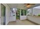 This is a screened in porch with ceiling fan, perfect for relaxing and enjoying the outdoors at 7018 Mallard Way, Plainfield, IN 46168