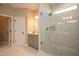 Modern bathroom with a glass-enclosed shower, marble tiles, and stylish vanity at 7032 Portico Ln, McCordsville, IN 46055