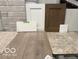 Compilation of flooring, brick, and cabinet door samples in the home at 7032 Portico Ln, McCordsville, IN 46055