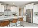 Stylish kitchen island features a white countertop, stainless steel appliances, and ample storage at 7032 Portico Ln, McCordsville, IN 46055