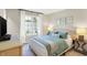 Comfortable bedroom with a large window providing natural light, complemented by stylish furnishings at 7110 Koldyke Dr, Fishers, IN 46038