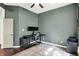 Neutral toned bedroom with a ceiling fan and carpet with work-station setup at 7110 Koldyke Dr, Fishers, IN 46038