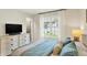 Comfortable bedroom with a large window providing natural light, complemented by stylish furnishings at 7110 Koldyke Dr, Fishers, IN 46038