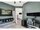 Modern home office with a large work space and open view to living spaces at 7110 Koldyke Dr, Fishers, IN 46038