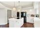 Bright kitchen with white cabinetry, modern island and stainless steel appliances at 7110 Koldyke Dr, Fishers, IN 46038