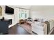 Bright living room with neutral colored sofa, lots of seating and fireplace at 7110 Koldyke Dr, Fishers, IN 46038