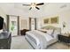 Bright main bedroom with high ceilings, carpeted floors, and natural light from surrounding windows at 7110 Koldyke Dr, Fishers, IN 46038