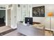 Bright office space with lots of light, desk, stylish decor and beige area rug at 7110 Koldyke Dr, Fishers, IN 46038