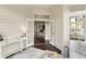 Sitting room leads into office space with white trim, hardwood floors, and natural light at 7110 Koldyke Dr, Fishers, IN 46038