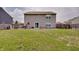 Large backyard with a patio area, perfect for entertaining and enjoying the outdoors with a grass area at 7303 Beal Ln, Indianapolis, IN 46217