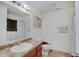 Bright bathroom with a shower-tub combo, neutral color palette, and a vanity with sink at 7303 Beal Ln, Indianapolis, IN 46217