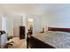 Spacious bedroom featuring dark wood furniture, a comfortable bed, and closet space at 7303 Beal Ln, Indianapolis, IN 46217