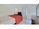 Bright bedroom featuring a comfortable bed, dresser, and a window for natural light at 7303 Beal Ln, Indianapolis, IN 46217