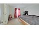Bright bedroom featuring a comfortable bed, ample natural light and neutral paint scheme at 7303 Beal Ln, Indianapolis, IN 46217