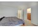 Bedroom with neutral walls, a bed and doorways providing access to closets and other spaces at 7303 Beal Ln, Indianapolis, IN 46217