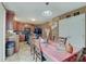 A dining room with table seating and direct access to the modern kitchen and backyard at 7303 Beal Ln, Indianapolis, IN 46217