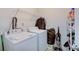 Functional laundry room featuring a washer, dryer, shelving and storage space at 7303 Beal Ln, Indianapolis, IN 46217