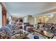 Open-concept living room features comfortable furnishings with access to the kitchen and backyard at 7303 Beal Ln, Indianapolis, IN 46217