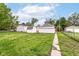 This backyard features a walkway, grass, shed, and fence at 736 N Dequincy St, Indianapolis, IN 46201