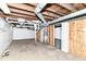 Unfinished basement featuring concrete walls, exposed ceiling, and water heater at 736 N Dequincy St, Indianapolis, IN 46201