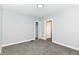 Spacious bedroom with soft carpet, neutral walls, closet, and two entryways at 736 N Dequincy St, Indianapolis, IN 46201