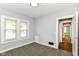 Neutral bedroom featuring carpeted floors, grey walls, and natural light from two windows at 736 N Dequincy St, Indianapolis, IN 46201