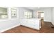 Bright and airy kitchen with white cabinets and a large stainless sink at 736 N Dequincy St, Indianapolis, IN 46201
