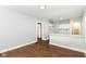 Bright space showcasing modern kitchen design with white cabinets, sleek countertops, and seamless connection to adjacent living area at 736 N Dequincy St, Indianapolis, IN 46201