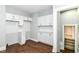 Bright kitchen features white cabinets and stainless steel appliances at 736 N Dequincy St, Indianapolis, IN 46201