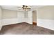 Spacious bedroom featuring soft carpet, a double closet, and ample natural light at 7425 E Thompson Rd, Indianapolis, IN 46239