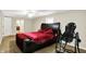 A roomy bedroom features a ceiling fan and a large bed at 7425 E Thompson Rd, Indianapolis, IN 46239