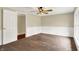 Inviting bedroom with a ceiling fan, plush carpet, and sun-filled window with pleasant views at 7425 E Thompson Rd, Indianapolis, IN 46239