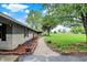 Charming brick walkway, lush plants, and colorful flower beds lead to this lovely home at 7425 E Thompson Rd, Indianapolis, IN 46239