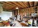 Spacious garage with overhead lighting and built-in shelving provides ample storage and workspace at 7425 E Thompson Rd, Indianapolis, IN 46239