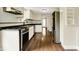 The kitchen is well-lit and features modern stainless steel appliances and white cabinets at 7425 E Thompson Rd, Indianapolis, IN 46239
