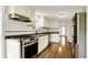 Spacious kitchen features modern stainless steel appliances and white shaker cabinets at 7425 E Thompson Rd, Indianapolis, IN 46239