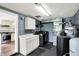 Functional laundry room with washer, dryer, storage cabinets, and utility sink at 7425 E Thompson Rd, Indianapolis, IN 46239