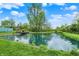 The pond located at the end of the lush green backyard at 7425 E Thompson Rd, Indianapolis, IN 46239
