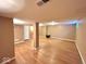 Unfinished basement featuring hardwood flooring, neutral walls, and recessed lighting at 7621 Forest Dr, Fishers, IN 46038