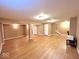 Large basement featuring hardwood flooring, neutral walls, and recessed lighting at 7621 Forest Dr, Fishers, IN 46038