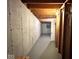 Unfinished basement featuring concrete walls, exposed wood beams, and utility access at 7621 Forest Dr, Fishers, IN 46038