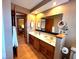 Bathroom featuring dual sinks, wood flooring and an abundance of natural light at 7621 Forest Dr, Fishers, IN 46038