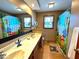 Bright bathroom with a double sink vanity, and fun animal themed shower curtain at 7621 Forest Dr, Fishers, IN 46038