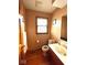 Cozy bathroom with a vanity, toilet, and window, creating a functional space at 7621 Forest Dr, Fishers, IN 46038