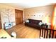 A bright bedroom featuring wall decals, wood flooring and a brown futon at 7621 Forest Dr, Fishers, IN 46038