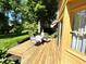 Wooden deck features table and chairs, perfect for outdoor dining and entertaining at 7621 Forest Dr, Fishers, IN 46038