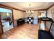 Open dining room with hardwood floors, seamlessly connecting to adjacent living spaces at 7621 Forest Dr, Fishers, IN 46038
