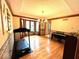 Elegant dining room featuring a chandelier and hardwood floors, perfect for gatherings at 7621 Forest Dr, Fishers, IN 46038
