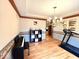 Inviting dining room with hardwood floors, blending style and functionality seamlessly at 7621 Forest Dr, Fishers, IN 46038