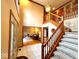 Spacious foyer with a grand staircase, tall ceilings, and views into adjacent living areas, creating an open and welcoming entrance at 7621 Forest Dr, Fishers, IN 46038